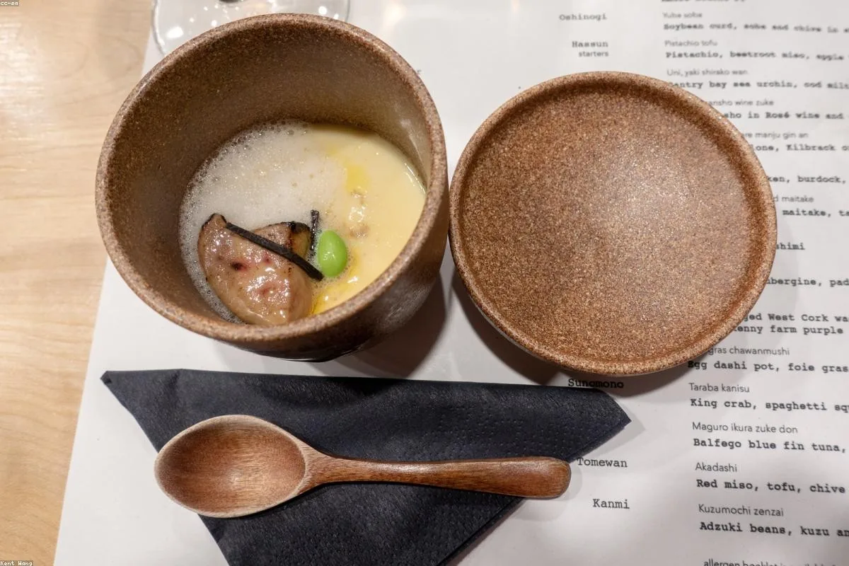 Kaiseki course served in lacquered bowls with a wooden spoon
